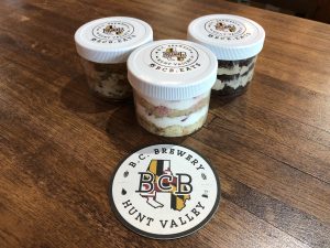 pic of 3 desert cups with BCB Eats stickers on their lids. chocolate, strawberry shortcake, and chocolate chip are featured with a BCB coaster in front of them