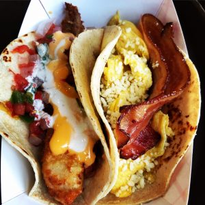 a photo of a fish taco with sauce on the left and a breakfast taco with bacon on the right